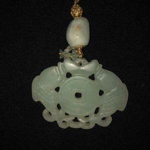 Natural stone necklace with carved pendant